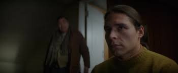 Adult Saul in a doorway